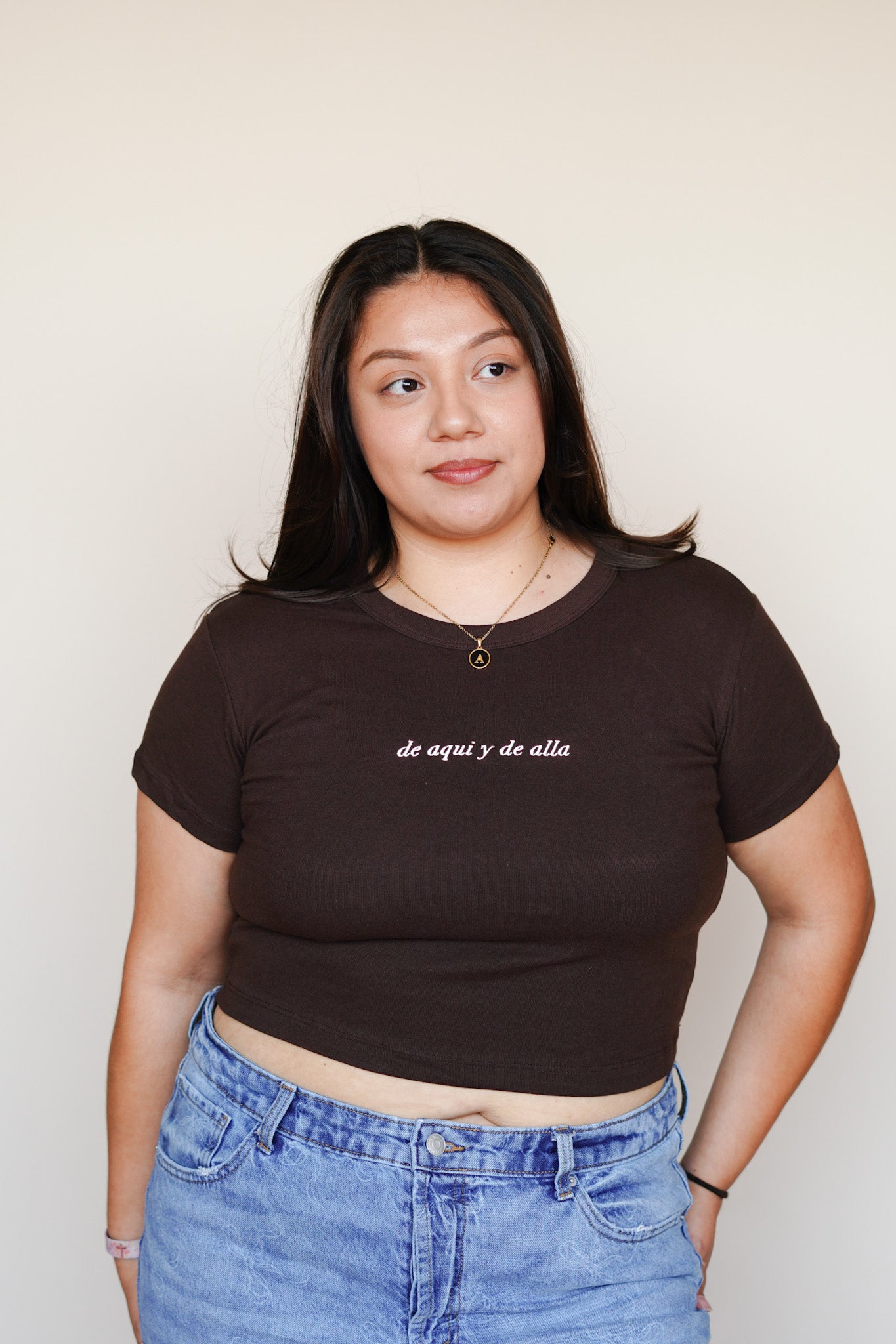 'De Aquí y De Allá' Embroidered Brown Rib Baby Tee
