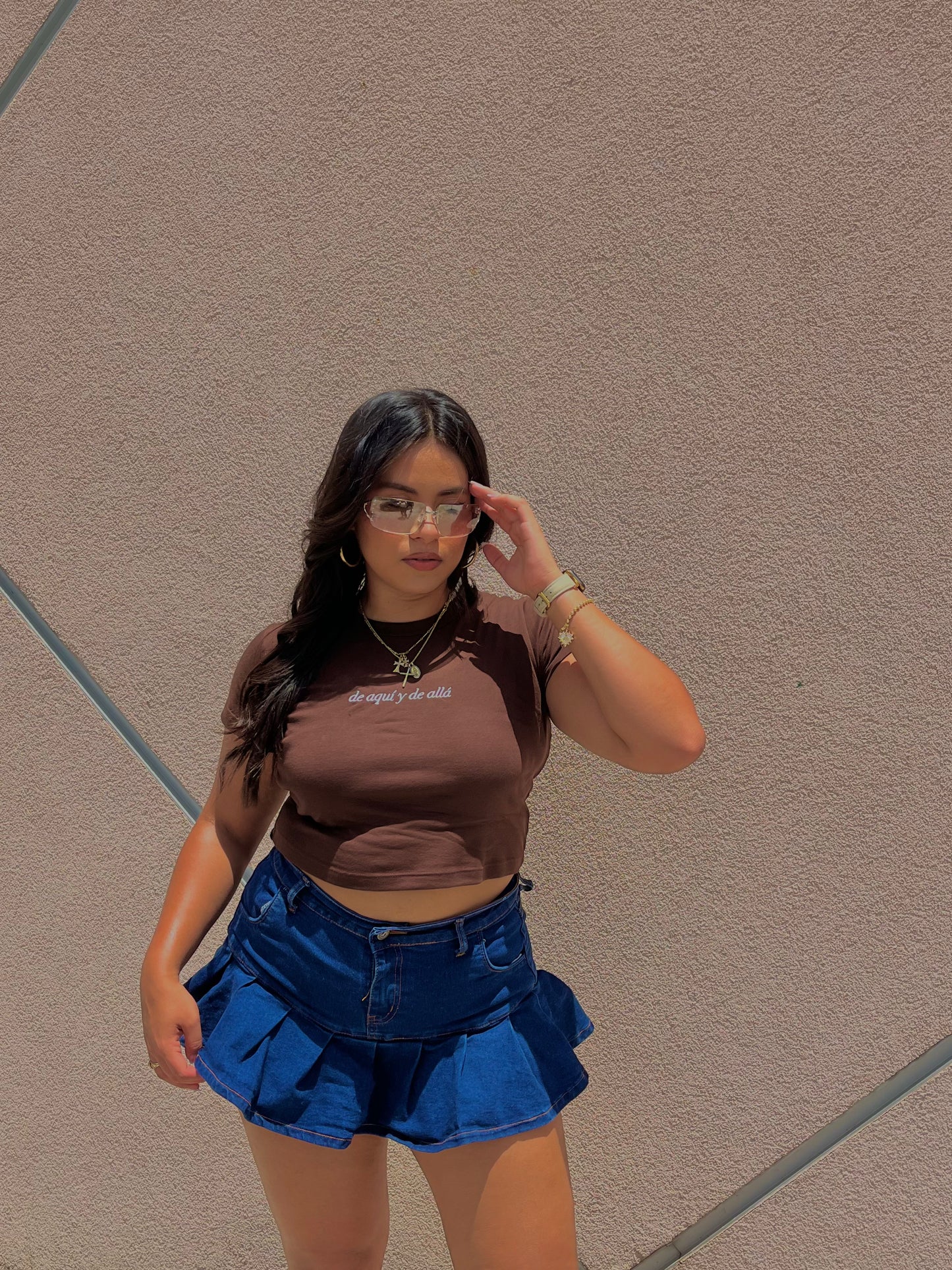 'De Aquí y De Allá' Embroidered Brown Rib Baby Tee